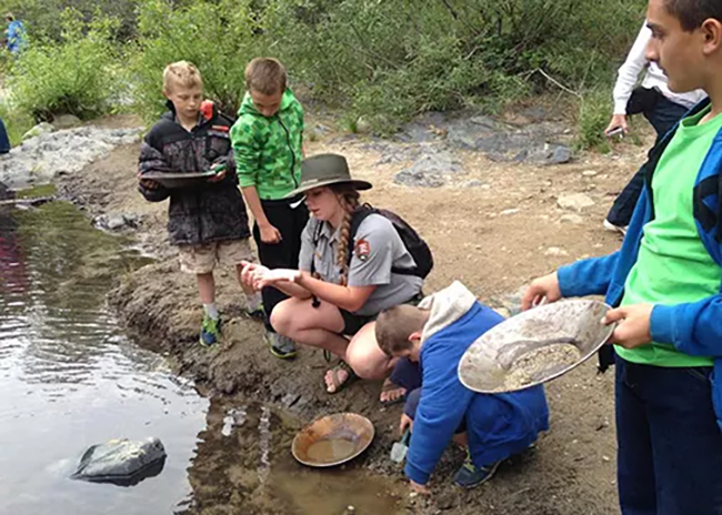 Panning for gold while attending the park's gold rush program, Whiskeytown National Recreation Area / NPS file
