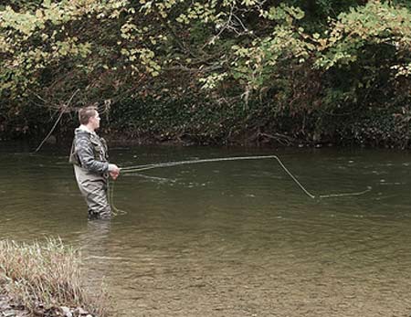 Man fly fishing.