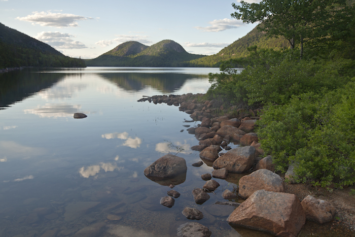 Stop at the Jordan Pond House for popovers and you’ll likely find yourself out on the lawn staring across the pond to the two rounded “Bubbles” on the far shore / Colleen Miniuk-Sperry Stop at the Jordan Pond House for popovers and you’ll likely find yourself out on the lawn staring across the pond to the two rounded “Bubbles” on the far shore / Colleen Miniuk-Sperry