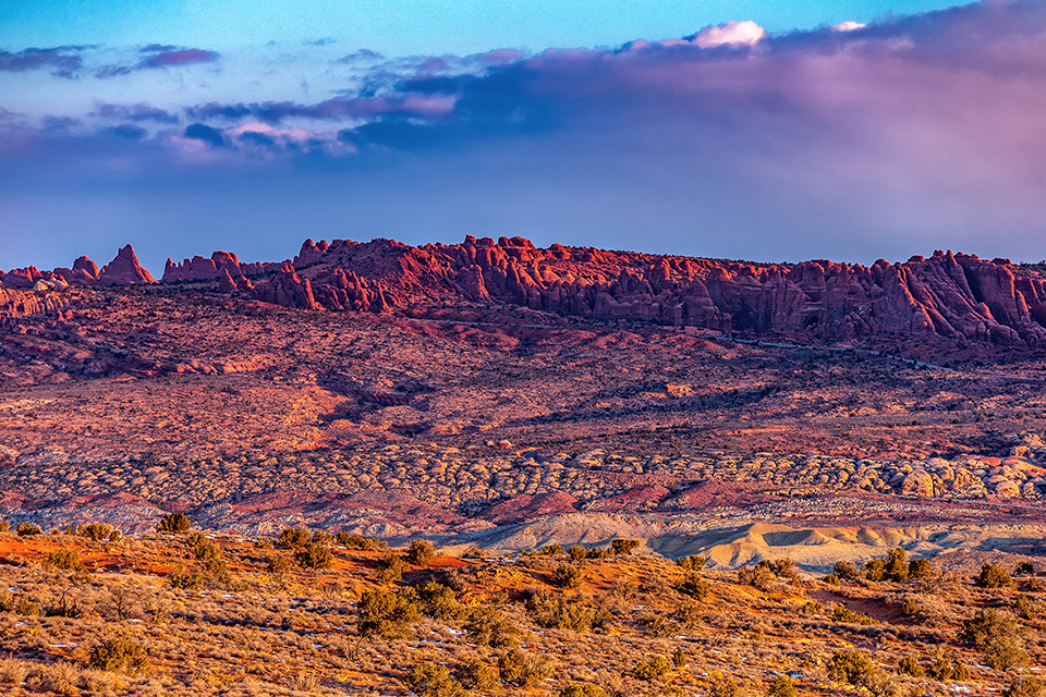 Sunrise light across Salt Valley, Arches National Park / Rebecca Latson Sunrise light across Salt Valley, Arches National Park / Rebecca Latson