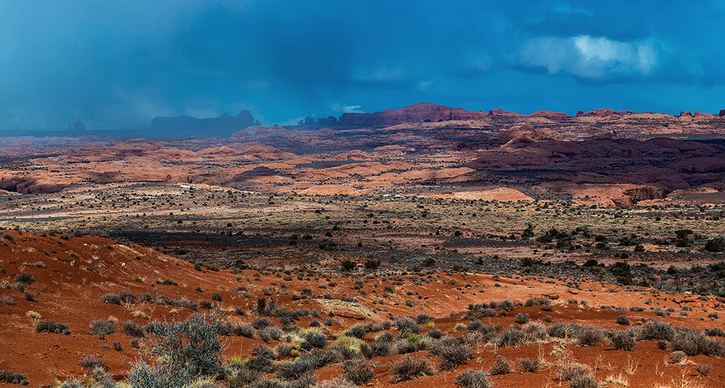 Sunlight and snowfall over the landscape, Arches National Park / Rebecca Latson
