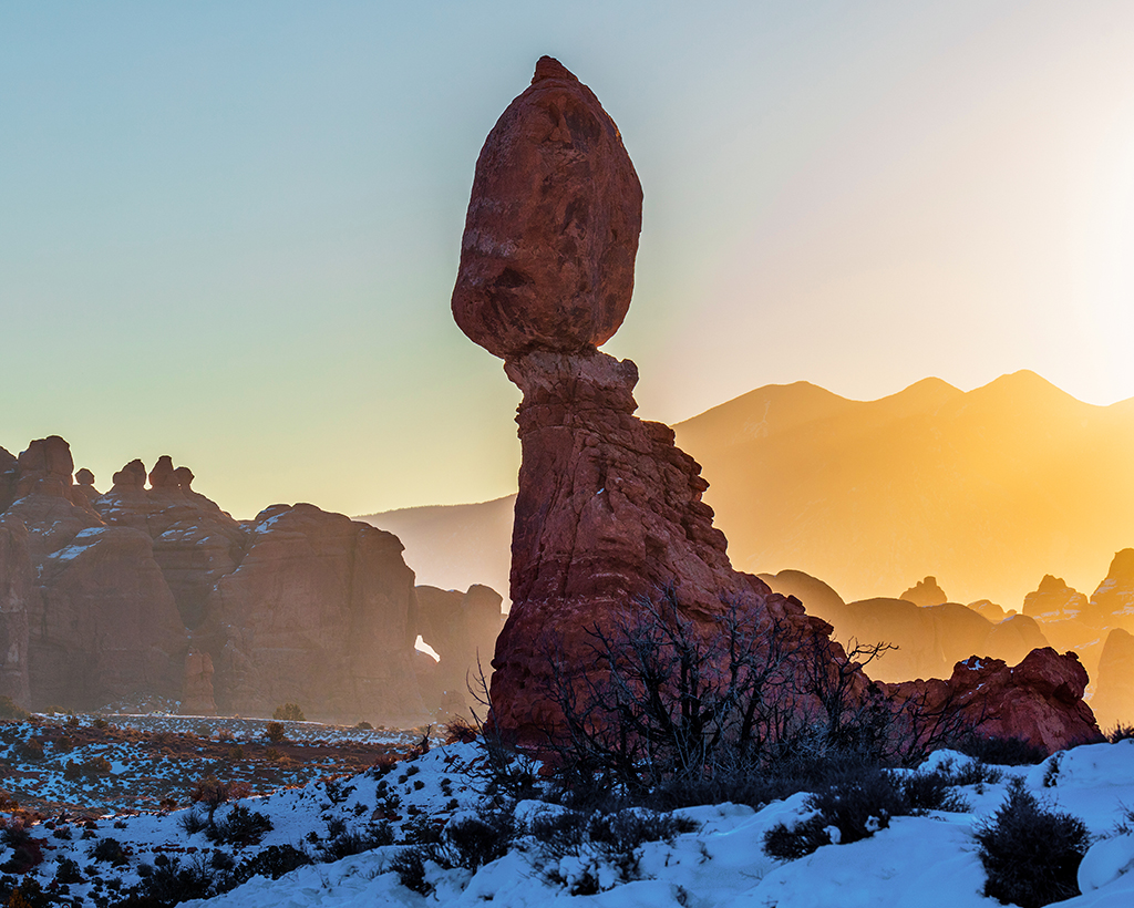 A winter sunrise over Balanced Rock, Arches National Park / Rebecca Latson