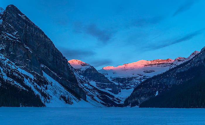 Morning Alpenglow Over Lake Louise - Crop, Banff National Park / Rebecca Latson Morning Alpenglow Over Lake Louise - Crop, Banff National Park / Rebecca Latson