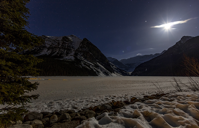Early Morning Moon And Stars At Lake Louise, Banff National Park / Rebecca Latson Early Morning Moon And Stars At Lake Louise, Banff National Park / Rebecca Latson
