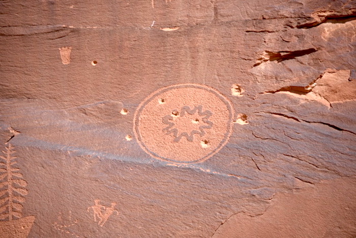Bullet-pocked pictographs in Butler Wash/John Miles