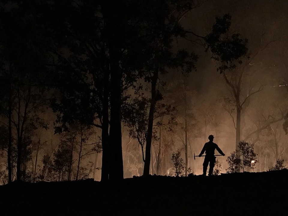 A firefighter against the flames of Australia's wildfire season/BLM, Michael Doherty 