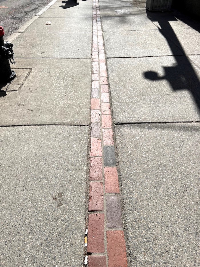 A red brick path leads you down the Freedom Trail in Boston/Barbara Jensen