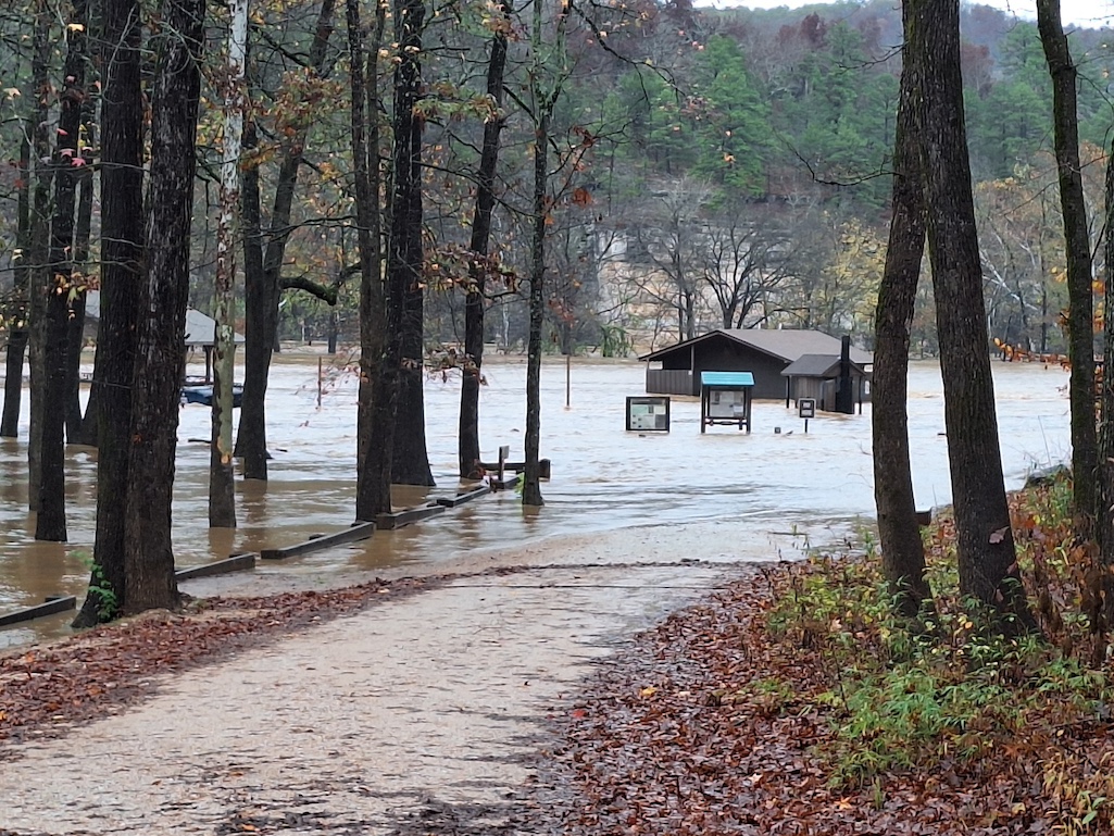 The Ozark Campground under flood waters as seen from the entrance to the campground. NPS Photo/E. Lindberg