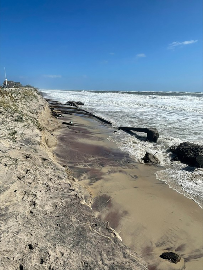 Eroded stretch of beach containing old infrastructure at Cape Hatteras National Seashore / NPS file