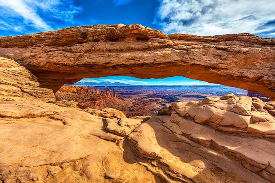 A midday view of Mesa Arch and the vista beyond, Canyonlands National Park / Rebecca Latson
