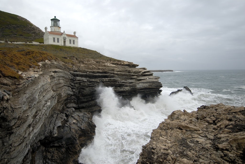 The second Point Conception lighthouse was rebuilt in 1881 and relocated to the lower bluff of the cape 133 feet above the Pacific Ocean, where fog would be less likely to obscure the light.  Credit: Robert Schwemmer, NOAA