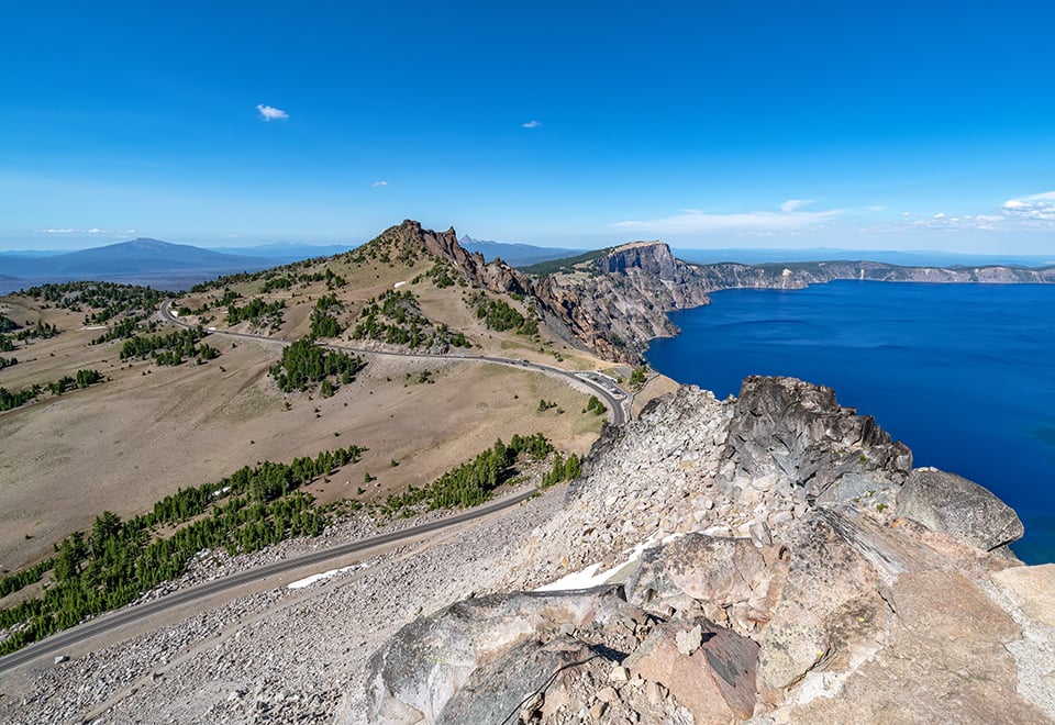 Rim Drive and Crater Lake from the Watchman Peak summit, Crater Lake National Park / Rebecca Latson Rim Drive and Crater Lake from the Watchman Peak summit, Crater Lake National Park / Rebecca Latson