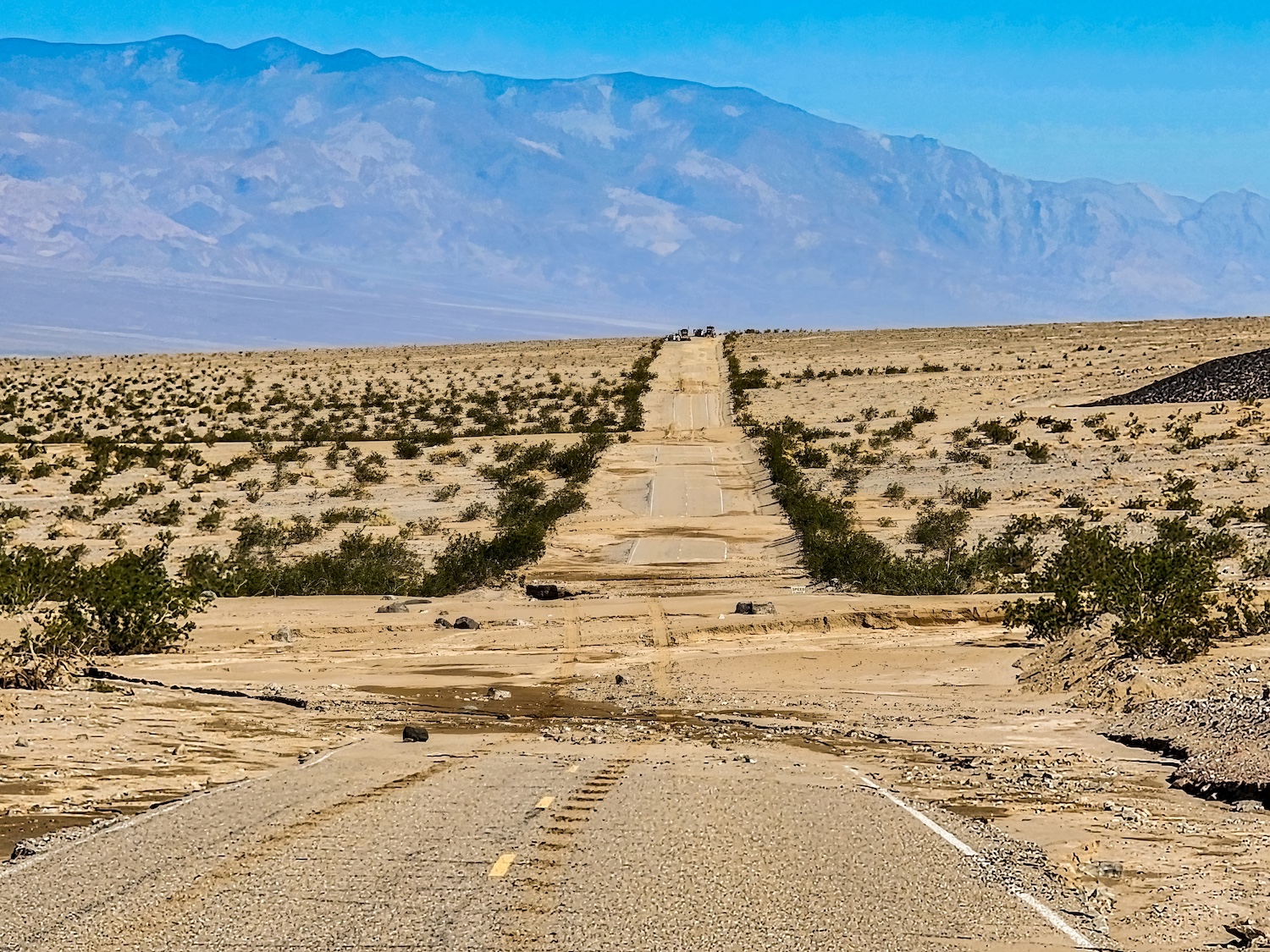 Racing down the steep slopes of the Amargosa Range, floodwaters roared across every low point on Badwater Road south of Furnace Creek, California, in Death Valley National Park. Racing down the steep slopes of the Amargosa Range, floodwaters roared across every low point on Badwater Road south of Furnace Creek, California, in Death Valley National Park.