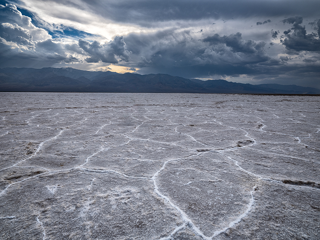 Salt flat and storm clouds at Badwater Basin, Death Valley National Park / Rebecca Latson Salt flat and storm clouds at Badwater Basin, Death Valley National Park / Rebecca Latson
