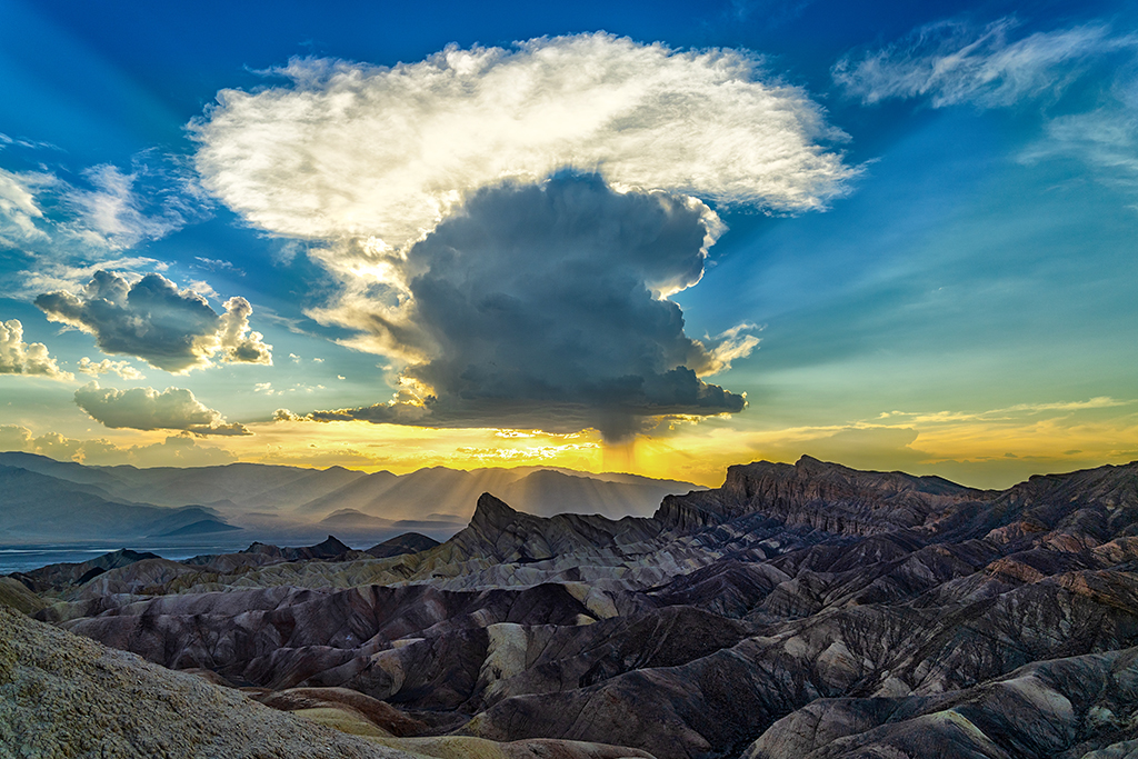 Sunset and a summer thundercloud over Zabriskie Point, Death Valley National Park / Rebecca Latson Sunset and a summer thundercloud over Zabriskie Point, Death Valley National Park / Rebecca Latson