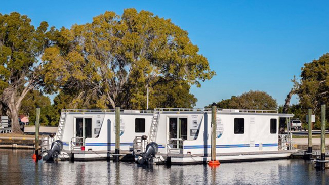 Explore Everglades scenery from the water while bring along the comforts of home by renting a houseboat, Everglades National Park / Everglades Adventures via NPS