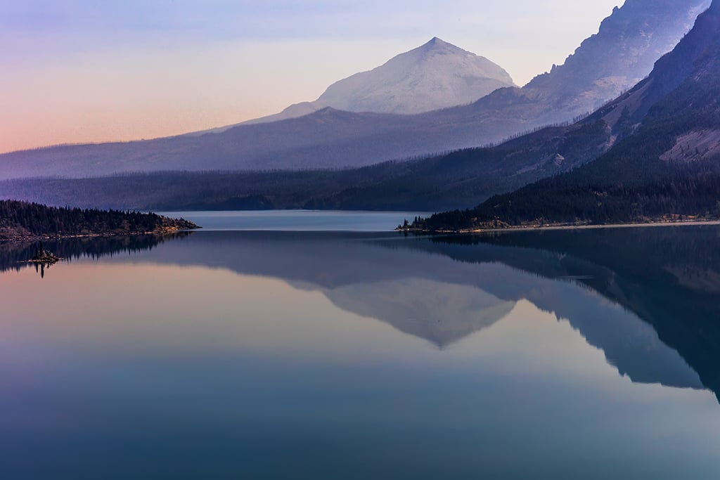 Saint Mary Lake reflections on a hazy day, Glacier National Park / Rebecca Latson