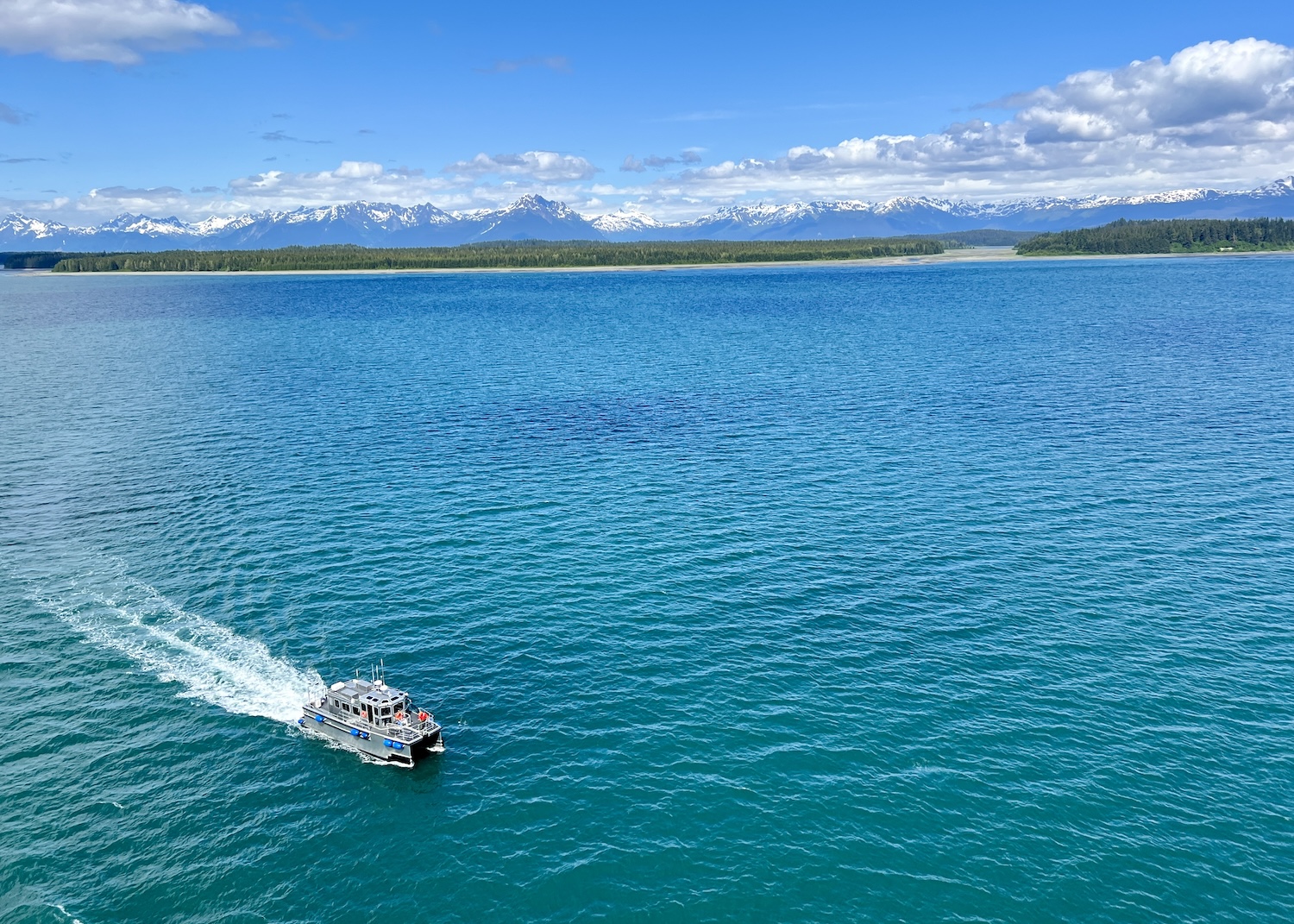 In Glacier Bay National Park and Preserve in Alaska, a NPS boat approaches to pick up rangers from the Discovery Princess.
