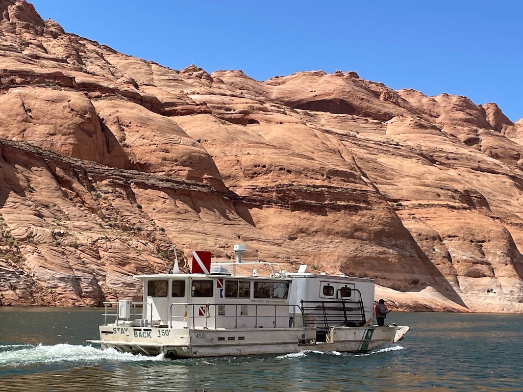 The National Park Service used a boat big enough to hold a horse trailer to rescue the horses/NPS