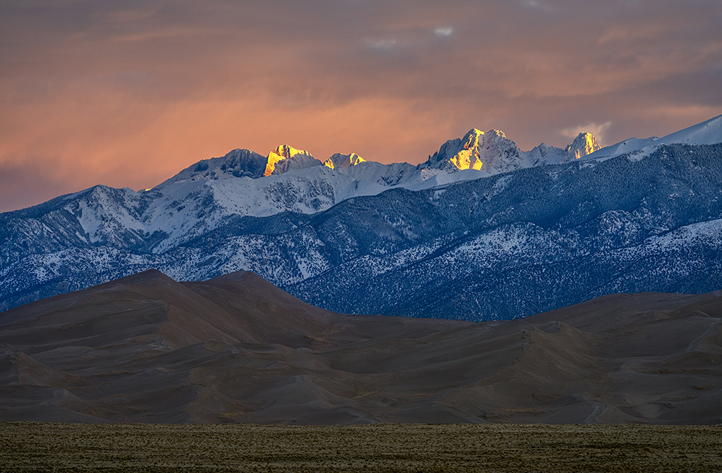 A telephoto sunrise over Great Sand Dunes National Park and Preserve / Rebecca Latson