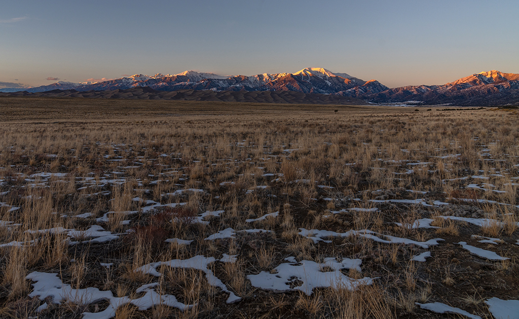 Sunset from the pullout at the junction of Colorado Highway 150 and Lane 6 North looking toward Great Sand Dunes National Park and Preserve / Rebecca Latson