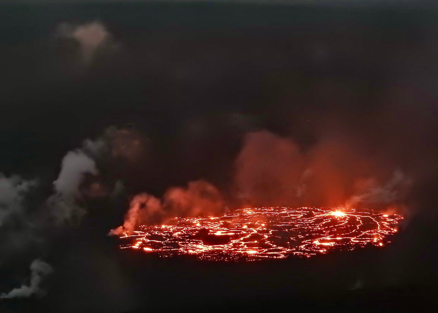 The view of the lava lake from the Kīlauea Overlook in February. The view of the lava lake from the Kīlauea Overlook in February.