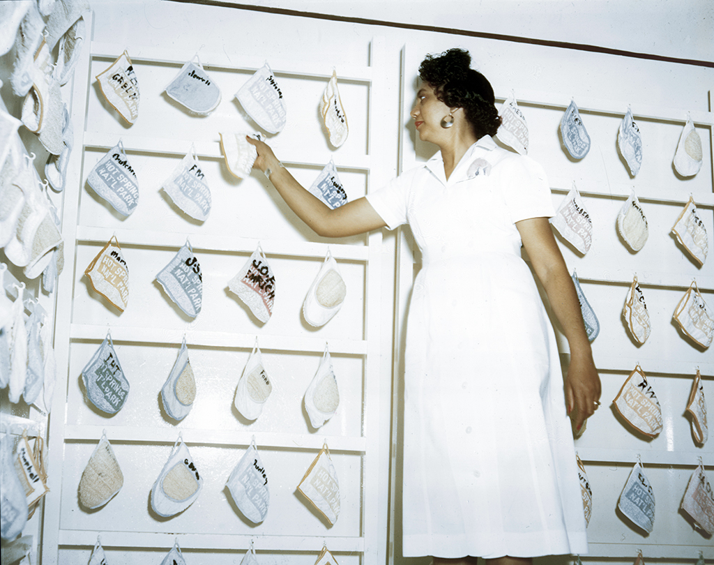 A Fordyce Bathhouse attendant and wall of patrons' bath mitts, Hot Springs National Park / NPS Archives A Fordyce Bathhouse attendant and wall of patrons' bath mitts, Hot Springs National Park / NPS Archives