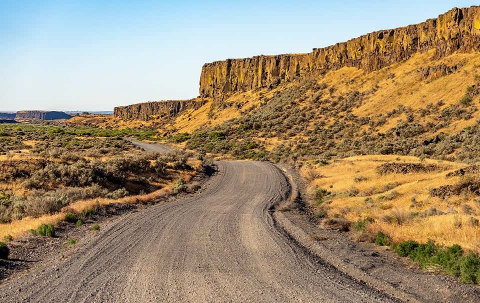 The view down that gravel road through Drumheller Channels National Natural Landmark, Ice Age Floods National Geologic Trail / Rebecca Latson The view down that gravel road through Drumheller Channels National Natural Landmark, Ice Age Floods National Geologic Trail / Rebecca Latson