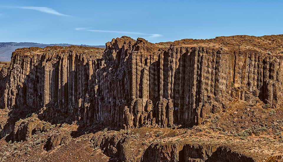 I spy wtih my little eye: a tiny hiker on top of columnar basalts in Frenchman Coulee, Ice Age Floods National Geologic Trail / Rebecca Latson I spy wtih my little eye: a tiny hiker on top of columnar basalts in Frenchman Coulee, Ice Age Floods National Geologic Trail / Rebecca Latson