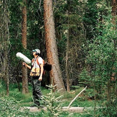 Summer scene of Jacob Job recording in a forest at Wild Basin, Rocky Mountain National Park, Colorado/Photo courtesy of Jacob Job