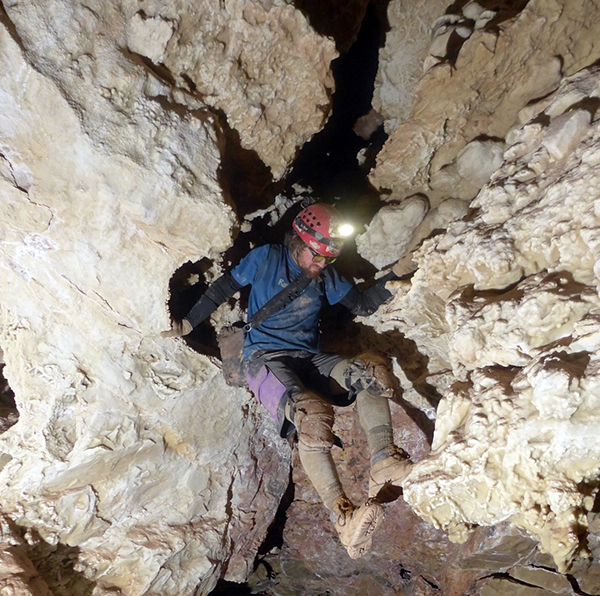 Caver maneuvering a vertical passage, Jewel Cave National Monument / NPS file Caver maneuvering a vertical passage, Jewel Cave National Monument / NPS file
