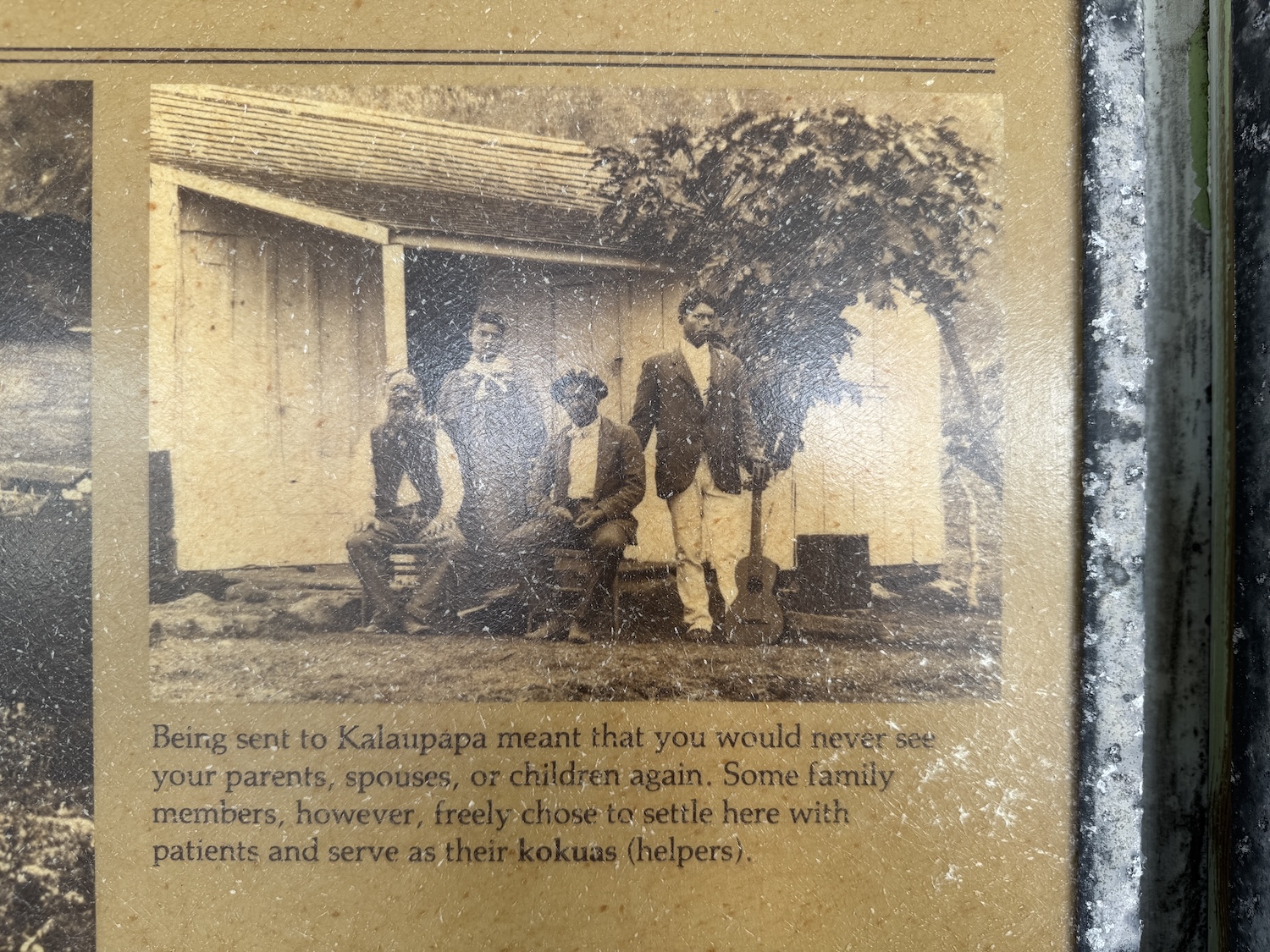 At the Kalaupapa airport, a fading vintage sign shows some of the early patient-residents.