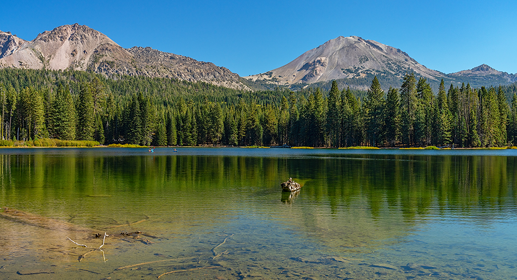 Kayakers enjoying a paddle on Manzanita Lake, Lassen Volcanic National Park / Rebecca Latson