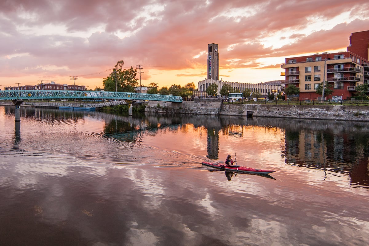 A lone kayaker in Lachine Canal National Historic Site. A lone kayaker in Lachine Canal National Historic Site.