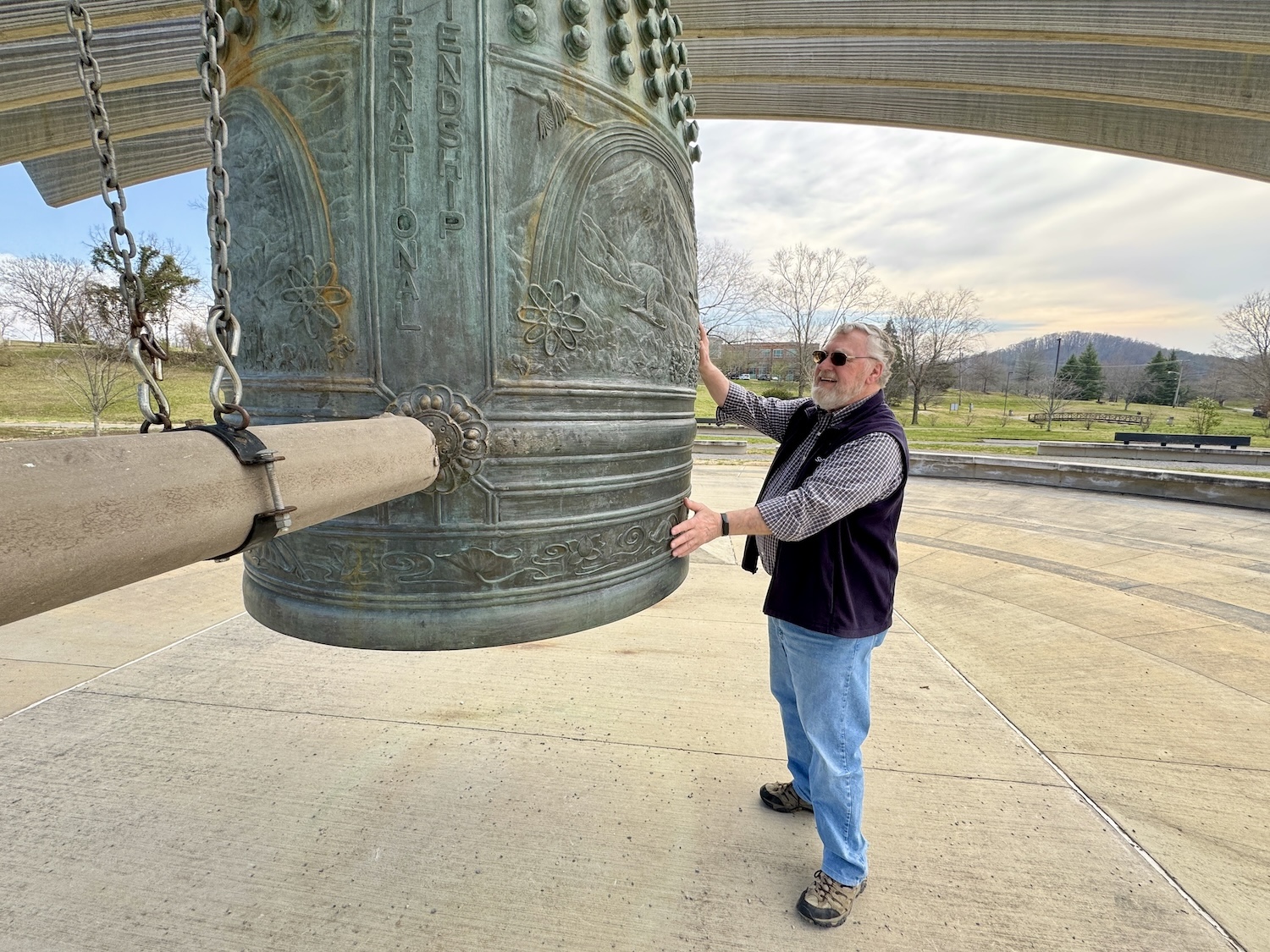 Oak Ridge historian Ray Smith, an expert on the Manhattan Project, rings the International Friendship Bell.