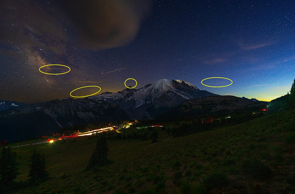 Plane light tracks in the night sky over Mount Rainier National Park / Rebecca Latson
