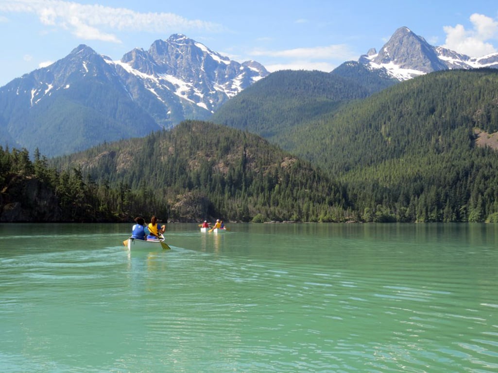 Canoers on the glacially-fed waters of Diablo Lake, Ross Lake National Recreation Area, North Cascades National Park Complex / North Cascades Institute Canoers on the glacially-fed waters of Diablo Lake, Ross Lake National Recreation Area, North Cascades National Park Complex / North Cascades Institute