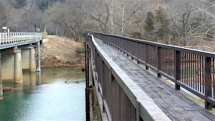 Piers beneath the Alley Spring pedestrian bridge adjacent to Highway 106 at Ozark National Scenic Riverways have been damaged by flooding, causing the bridge to become unstable/NPS