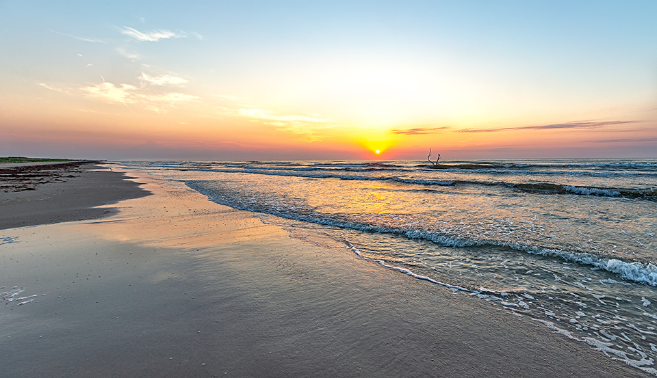 A calm summer sunrise over Malaquite Beach, Padre Island National Seashore / Rebecca Latson