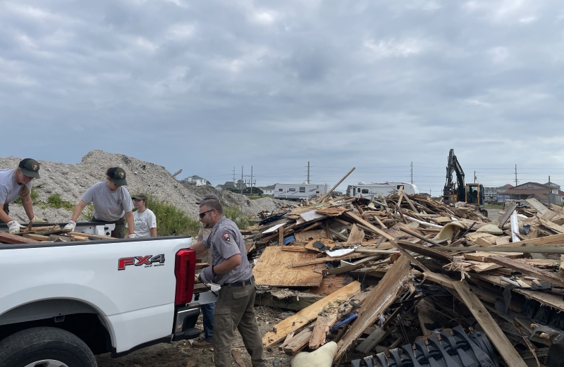 Cape Hatteras National Seashore staff work to offload house collapse debris at off-site staging area / NPS Cape Hatteras National Seashore staff work to offload house collapse debris at off-site staging area / NPS