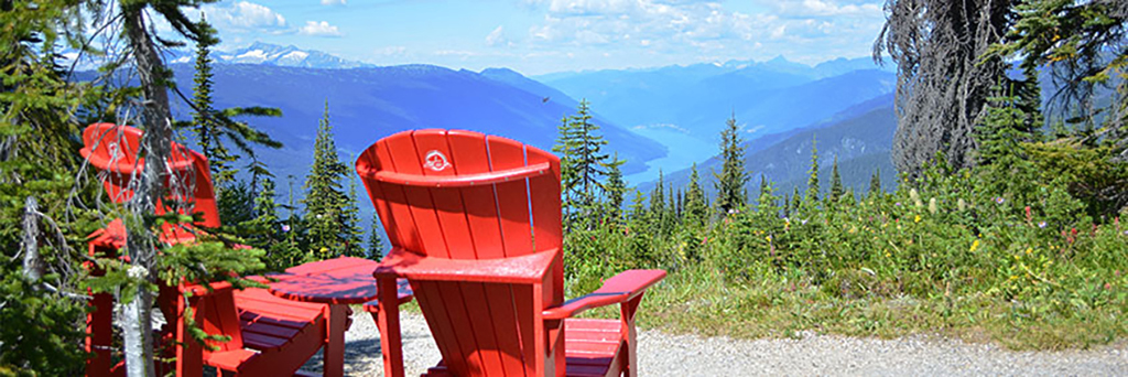 A red chair view of the landscape at Mount Revelstoke National Park / Parks Canada A red chair view of the landscape at Mount Revelstoke National Park / Parks Canada