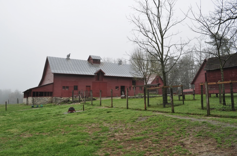 Fog rises over the pasture to the barn / NPS