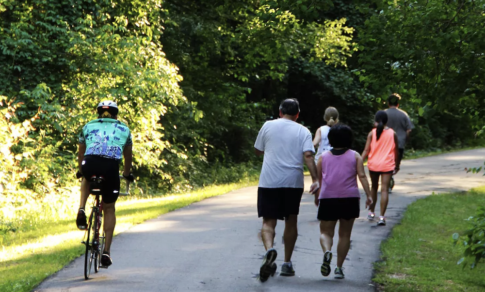Chisha Foka Multi-Use Trail / NPS Bicyclist and people sharing multi-use pathway in the trees.