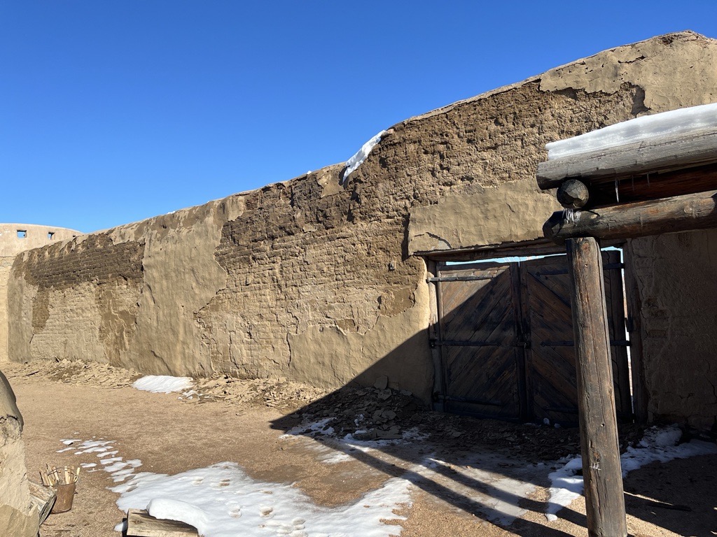 Side corral wall following the November 2024 snowstorm, displaying mousiture intrusion and visible damage.