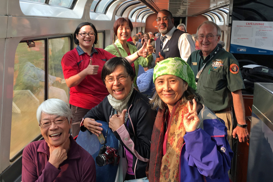 National Park Service Trails &amp;amp; Rails guide Jim Eagan talks with international travelers in the lounge car.
