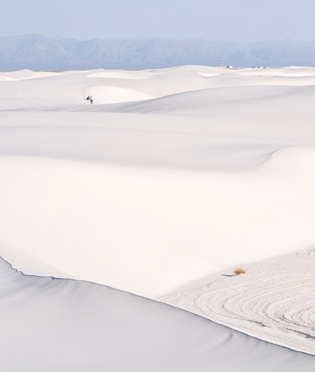 Plants, people, and distant buildings all add scale and reference to a photo where the size and scale might not be so apparent. White Sands National Park / Rebecca Latson