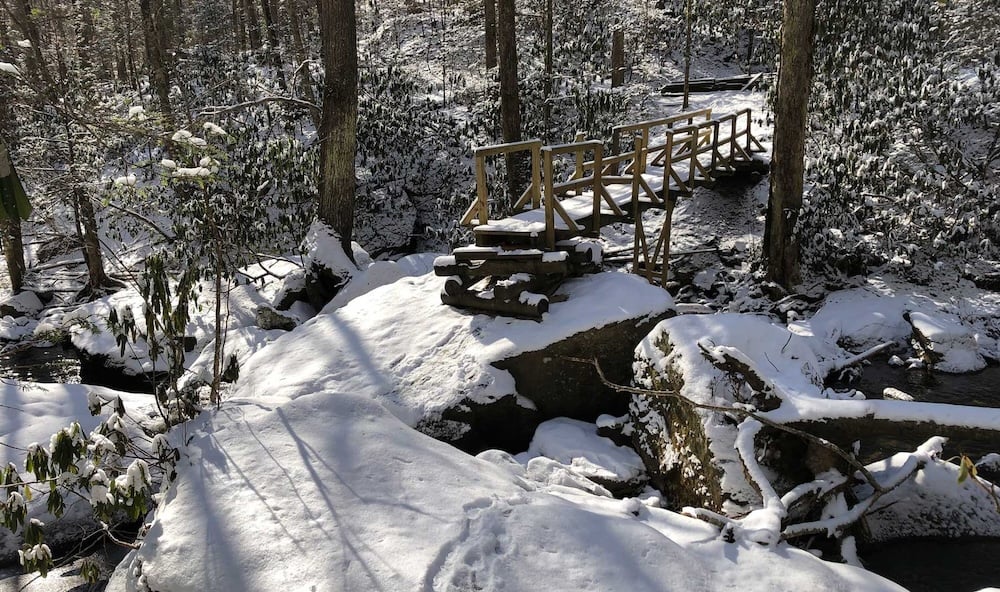 Big South Fork in winter / NPS a snow-covered bridge in the forest