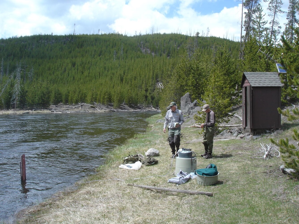Scientists sample water from the Firehole River in Yellowstone National Park. Work done under National Park Service research permit 5194. Scientists sample water from the Firehole River in Yellowstone National Park. Work done under National Park Service research permit 5194.