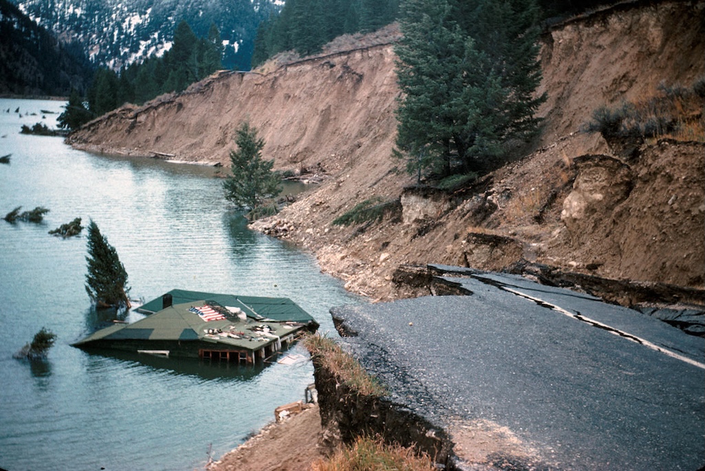 This house fell into Hebgen Lake during the 1959 earthquake and floated along the shore until it came to rest here. The owner of the house, then-70-year-old Mrs. Grace Miller, escaped only after kicking out her front door and leaping a 5-foot-wide ground 