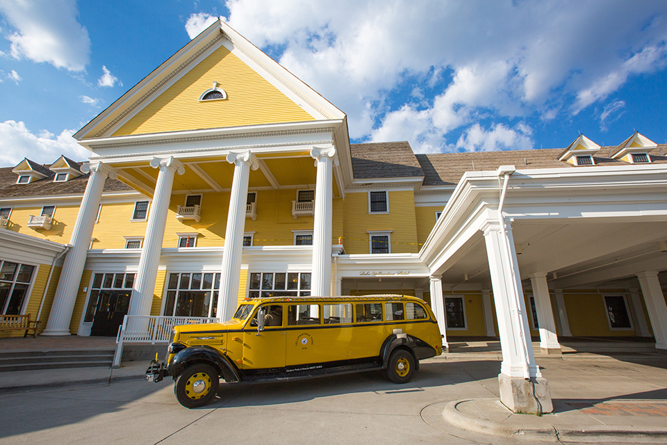 Lake Yellowstone Hotel and a yellow bus, Yellowstone National Park / NPS-Neal Herbert Lake Yellowstone Hotel and a yellow bus, Yellowstone National Park / NPS-Neal Herbert